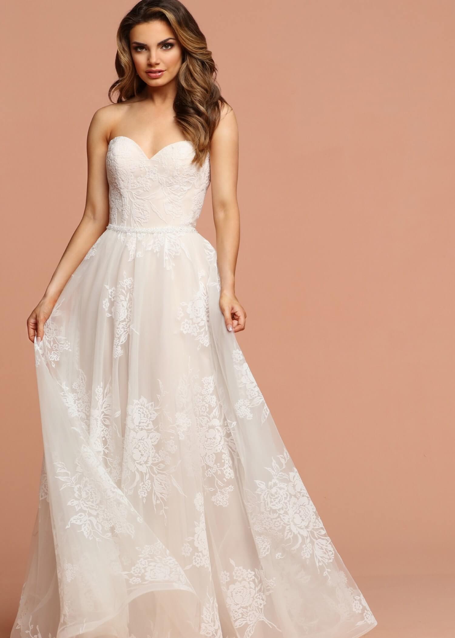 Photos of model wearing romantic style bridal gowns