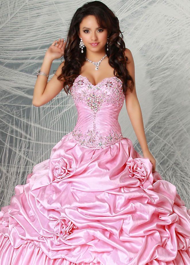 Model wearing a pink Quinceanera dress